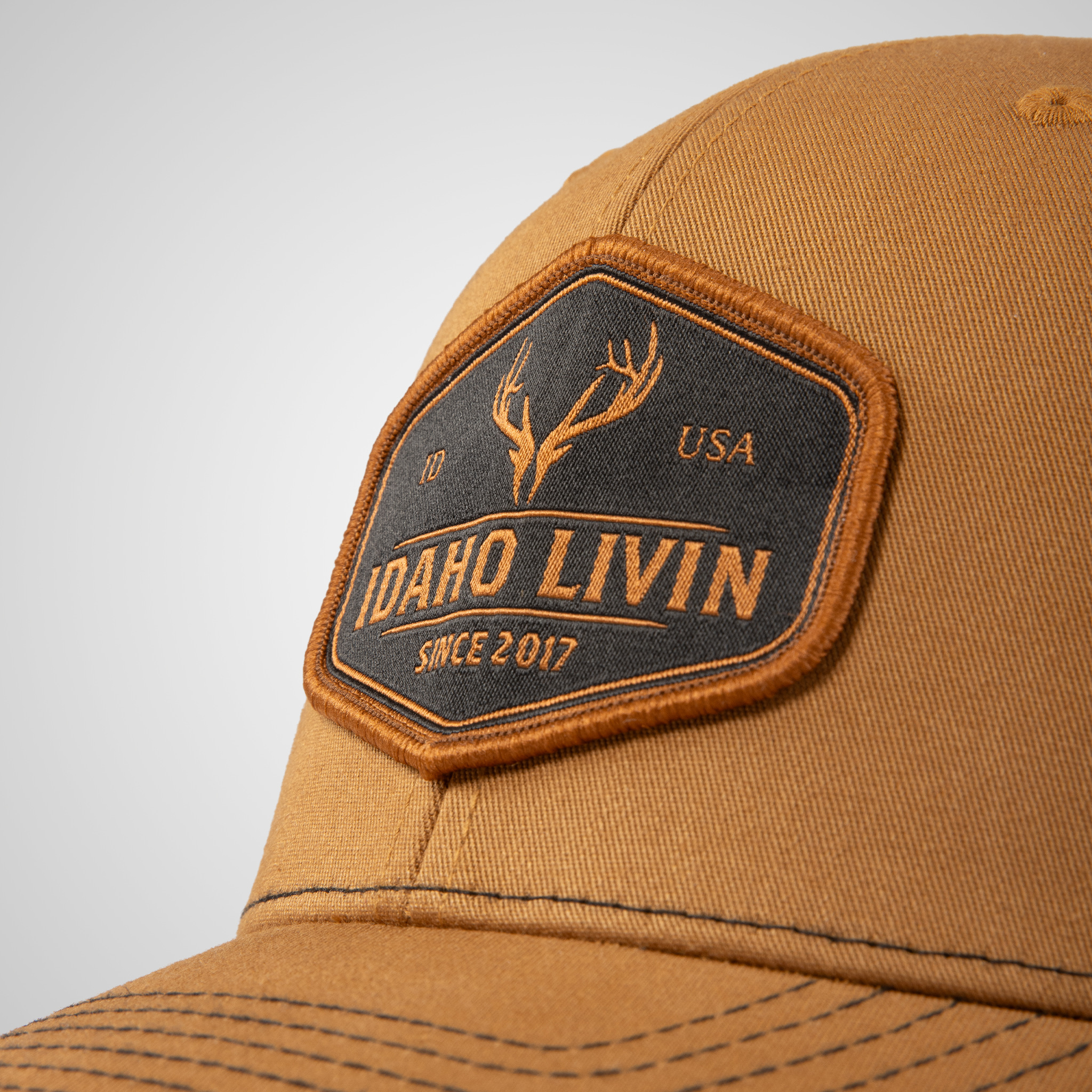 Elk Woven Patch Trucker Hat | Carmel/Black